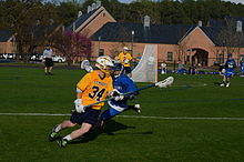 St. Mary's Seahawks varsity lacrosse player in motion. St. Mary's Seahawks varsity lacrosse team.jpg