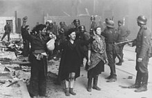 This photograph, from the Stroop Report, shows captured fighters in the Warsaw Ghetto Uprising. Stroop Report - Warsaw Ghetto Uprising 08.jpg
