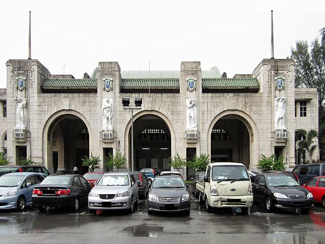 The art deco Tanjong Pagar Railway Station. The large initials "F M S R" stand for Federated Malay States Railways. The four white marble reliefs bene