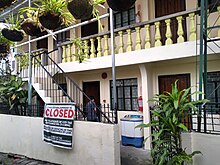 An apartment building closed for property tax arrears. Tax-delinquent apartment rental building in Santa Fe, Dasmarinas, Cavite.jpg