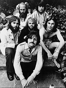 The Beach Boys in 1971. Left to right, starting from back row: Mike Love, Brian Wilson, Carl Wilson, Al Jardine, Dennis Wilson, Bruce Johnston. The Beach Boys Billboard 1971.jpg