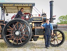 Two operators seen after taking part in a parade with their engine, Earl Douglas at Otley carnival in Yorkshire, England Traction Engine Mechanics.jpg