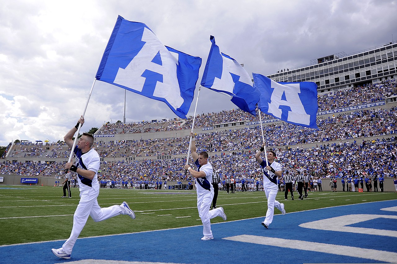 File:U.S. Air Force Academy (USAFA) junior Joseph Flescher, left, leads the  USAFA banners across the end zone after a touchdown during the USAFA  Falcons football game against the Idaho State Bengals at