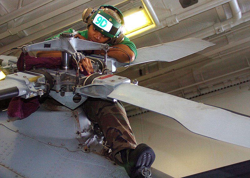 File:US Navy 050316-N-0535P-051 Aviation Machinist's Mate Airman Evita Levell, assigned to the Dusty Dogs of Helicopter Anti-Submarine Squadron Seven (HS-7), conducts preventative maintenance on the tail rotor of an SH-60 Seahawk.jpg