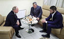 Nurmagomedov and his father meeting Russian President Vladimir Putin four days after his win against McGregor Vstrecha s rossiiskim bortsom Khabibom Nurmagomedovym.jpg