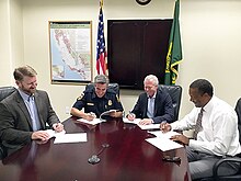 On 16 August 2017 a Memorandum of Understanding was signed between parties interested in reducing wildfires on federal, state and Sierra Pacific Industries land in California. Members of the National Fish and Wildlife Foundation, California Department of Forestry and Fire Protection and U.S. Forest Service joined Mark Emmerson of SPI (second right) in making the declaration. 170816-FS-PSWRO-PRW-001-SPI-NFWF-USFS-CALFIRE-USFWS-MOU-Signing-PaulWade (36479603771).jpg