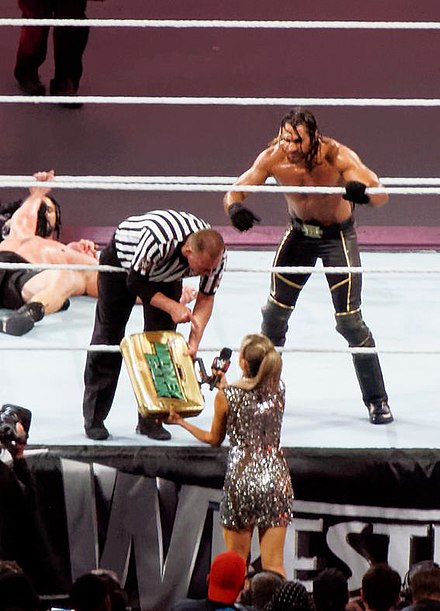 Seth Rollins cashing in his Money in the Bank contract at WrestleMania 31