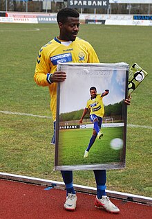 Ayinde Jamiu Lawal receives the Player of the Year Award 2011.