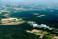 Former barracks area (right) with military training area (left);  Würth Industrie Service's headquarters since a conversion