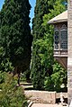 Private balcony with a lone tourist in white - at the Beiteddine Palace in Lebanon