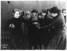 Film still of Billie Burke boxing with woman in a gymnasium.