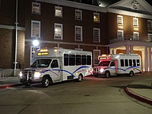 Minibuses operating on SafeRides, an overnight demand-responsive service operated by the Champaign-Urbana Mass Transit District in Champaign and Urbana, Illinois CUMTD Ford E-450 1801+1418 SafeRides.jpg