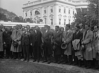The 1929 team visiting the White House, Nibs Price is to the left of President Hoover. Cal football team 1929 Nibs Price Herbert Hoover B.jpg