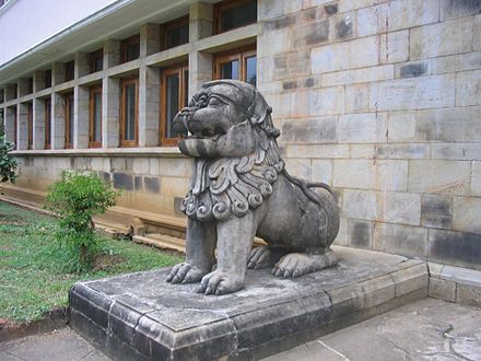 A traditional lion statue in front of the senate building of the university Campus lion UoP.jpg