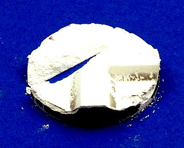 Fig. 1 A piece (formed with M KMS-96 alumina powder) has been broken after mold ejection. Ceramic cracked piece.jpg