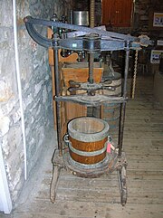 A cheese press and chessett from Dalgarven Mill Cheesepressdalgarven.JPG