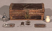 Family circumcision set and trunk, c. eighteenth century. Wooden box covered in cow hide with silver implements: silver trays, clip, pointer, silver flask, spice vessel. Circumcision set.jpg