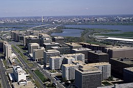 Aerial view of Crystal City (foreground) with I-395 crossing the Potomac River and the Jefferson Memorial and Washington Monument (background) in the 1980s Crystal City 80's.jpg