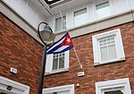 Cuban flag at half-mast on the Embassy in Dublin (30489692003).jpg