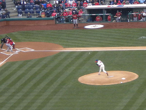 Roy Halladay throwing the first pitch of the 2011 season to the Astros' Michael Bourn on April 1