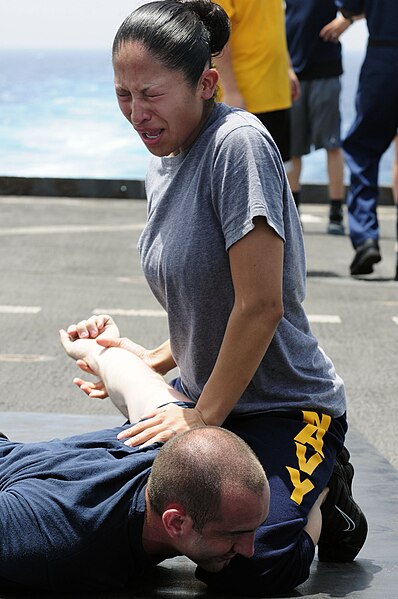 File:Defense.gov News Photo 110510-N-RC734-189 - Petty Officer 2nd Class Jaqueline Rodriguez subdues a simulated suspect after being sprayed with oleoresin capsicum spray also known as pepper.jpg