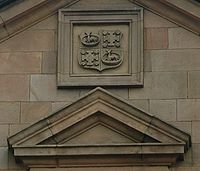 The cross potent quadrate and stag couchant of the school arms on 'B'-Block