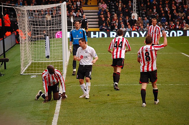 Healy (in white) playing against Sunderland in April 2008