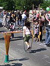 A young girl playing on a jump rope.
