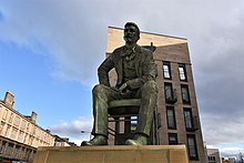 Glasgow. Statue of Mackintosh, unveiled on the 90th anniversary of his death. Sculptor: Andy Scott.