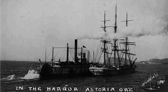 The second Harvest Queen at Astoria, Oregon, circa 1906, towing an ocean-going ship. Harvest Queen ca 1906.png