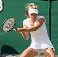 Katie Swan competing in the first round of the 2015 Wimbledon Qualifying Tournament at the Bank of England Sports Grounds in Roehampton, England. The winners of three rounds of competition qualify for the main draw of Wimbledon the following week.