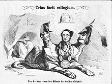 Karikatur im Kladderadatsch, Pamphlet deutscher Nationalisten gegen das Königreich Bayern von 1865: Es bezeichnet Bayern in Gestalt von der Pfordten als Höllenhund, der den Eingang zur Deutschen Einheit bewacht. Mit dem schwebenden Hut verweist der Zeichner darauf, dass Bayern die Königskrone erst durch den französischen Gewaltherrscher Napoleon I. erhalten hatte, oder aber darauf, dass Bayerns Verhalten im Interesse des aktuellen Kaisers Napoleon III. war.