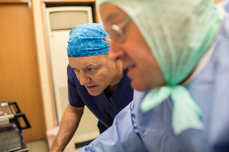 File:L-R Anaesthetist Sam Cosman from Canada and Andy Lyons a biomedical engineer from Australia inspect a piece of medical machinery inside Viola Hospital in Nuku'alofa. (10707499485).jpg