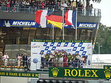 The podium for the top three overall race finishers Le Mans 2011 Podium.jpg