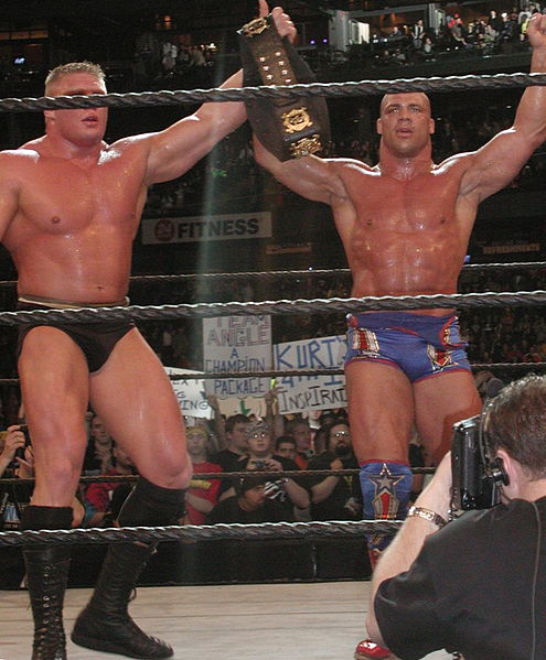 Angle and Brock Lesnar after their WWE Championship title match at WrestleMania XIX