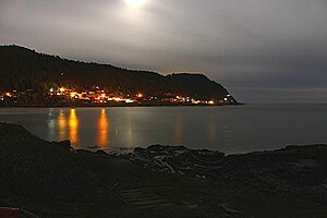 The lights of Yachats as seen from across the estuary