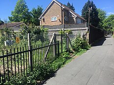 The site of Lynne Weedon's murder, pictured in May 2022. Her unidentified attacker hit her on the head with a blunt instrument as she walked down the alleyway, before lifting her over gates into the grounds of the electricity substation, where he then raped her Lynne Weedon 1975 crime scene.jpg