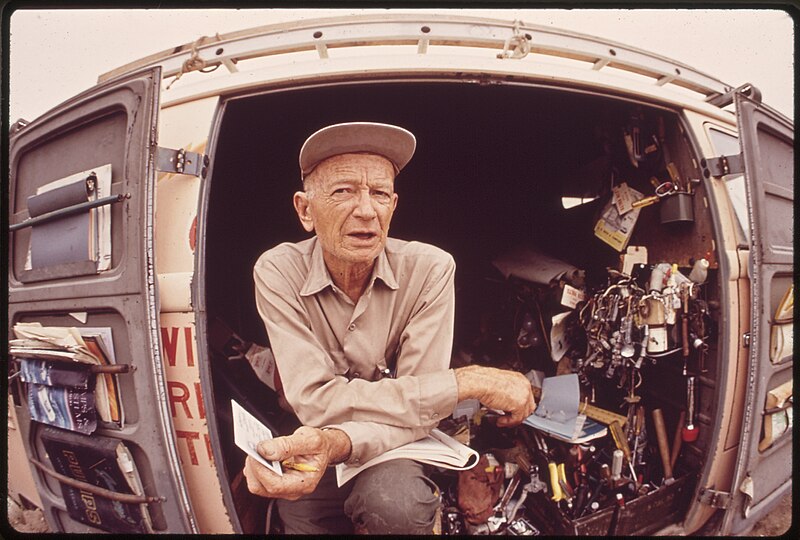 File:MAYOR CASEY IN THE TRUCK THAT IS HIS TRAVELING "OFFICE." HE USES THE DOORS FOR HIS "FILES." - NARA - 546186.jpg