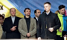 Valentyn Nalyvaichenko (speaking), the head of the Security Service of Ukraine (SBU), and Andriy Parubiy (far left), 23 March 2014 Maidan meeting 2014 march 23 (2).JPG
