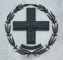 Partyzánský kříž na památníků deseti popravených 20. března 1944 ve Falejówce