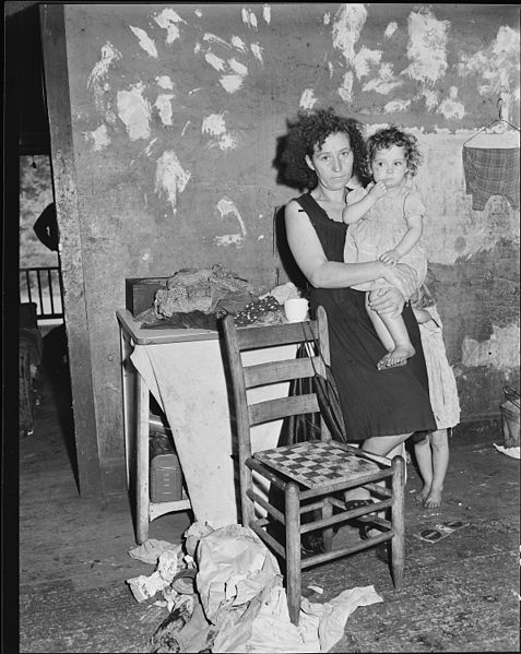 File:Mrs. Elige Hicks and her daughter in the kitchen of the four room house which rents for $10.50 monthly. Mrs. Hicks'... - NARA - 541034.jpg