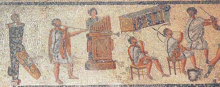 Musicians in a detail from the Zliten mosaic (2nd century AD), originally shown as accompanying gladiator combat and wild-animal events in the arena: from left, the tuba, hydraulis (water pipe organ), and two cornua