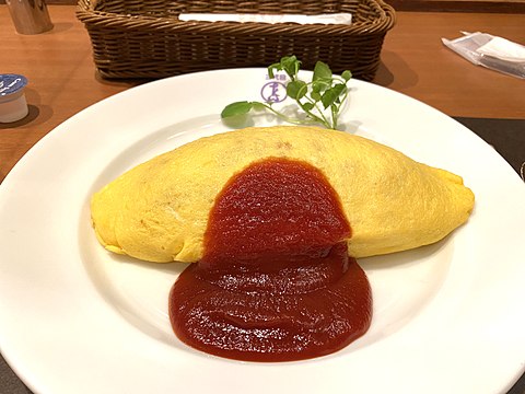 Omurice (Japanese omelette rice) with fried rice inside