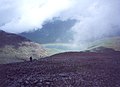 Looking down the stony north ridge of Meall a'Bhuiridh, to a rainbow in Glencoe