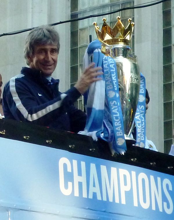 Manuel Pellegrini with the Premier League trophy during the club's victory parade, May 2014.
