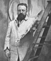 Portrait of Henri Matisse standing at his easel (cropped).jpg