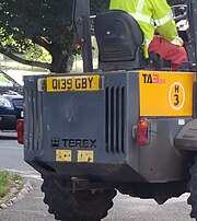 A construction vehicle bearing a Q number plate, August 2016, UK Q-plate on construction vehicle.jpg