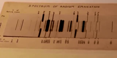 Emission spectrum of radon, photographed by Ernest Rutherford in 1908. Numbers at the side of the spectrum are wavelengths. The middle spectrum is of Radium emanation (radon), while the outer two are of helium (added to calibrate the wavelengths).