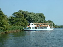 A river cruiser turning on the River Waveney at Seven Mile Carr, in Burgh St Peter parish southeast of the village River Waveney - geograph.org.uk - 140834.jpg
