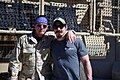 Robert Patrick in Captain USO mode with UFC fighter Tim Kennedy beside a Mine-Resistant Ambush Protected vehicle, or MRAP, as Army Gen, 2016, May.jpg
